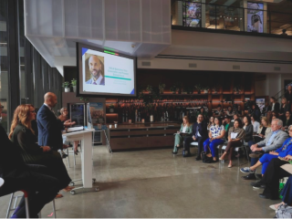 Executive Vice Chancellor and Provost Darnell Hunt delivers a speech to a crowd.
